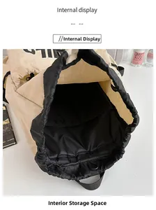Internal view of a lightweight drawstring backpack showing black lining and storage pockets
