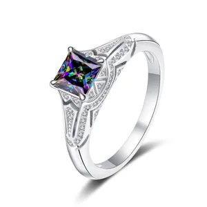Detail view of princess cut moissanite ring showing rainbow fire and hollow metal design