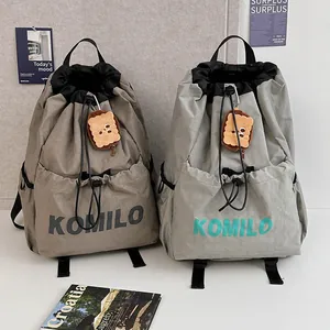 Unisex Lightweight Nylon Drawstring Backpack Large Capacity School Bag Casual Travel Bag With Plush Pendant