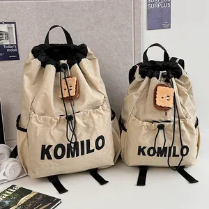 Lightweight drawstring sports backpacks in two sizes with plush bear charms and top handles