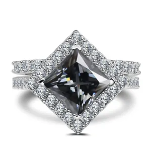 Macro detail of a 3CT princess cut grey gemstone ring with halo pave silver setting