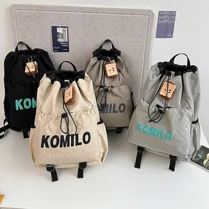 Lightweight drawstring sports backpacks in four colors with cute plush charms