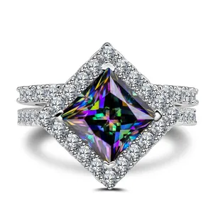 Macro shot of 925 silver ring featuring square rainbow stone and double-row pave diamonds