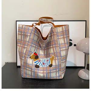 Detail of checkered canvas tote bag with cute dachshund embroidery and large capacity