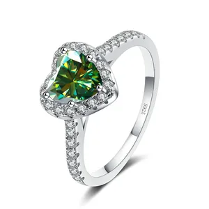 925 sterling silver ring featuring a 1 carat heart-shaped green moissanite with halo setting