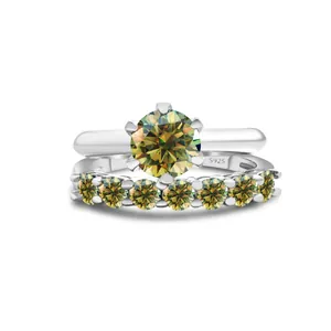 Detailed macro shot of S925 silver rings with yellow-green moissanite and hallmark