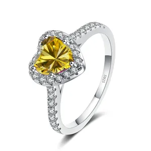 925 silver ring featuring a heart-cut yellow moissanite stone and side diamonds