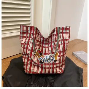 Detail of cute puppy embroidery on a reversible large capacity plaid canvas tote bag