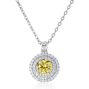 Close-up of double halo yellow moissanite pendant with sterling silver chain and stones