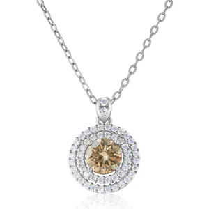Macro shot of 1ct champagne moissanite pendant with double halo and sparkling accents