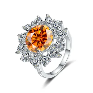 Macro detail of a 5ct pear-cut orange moissanite ring with floral petal setting