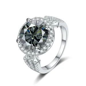 Macro view of a 5-carat round moissanite ring with halo setting and pavé silver band