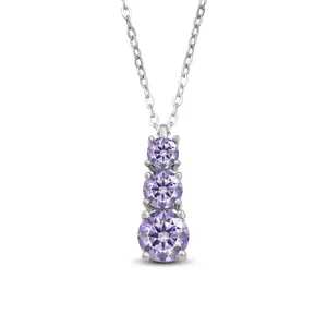 Macro shot of 1.8ct purple moissanite pendant with triple stone gradient design