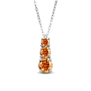 Close-up of S925 silver necklace with three graduated orange moissanite stones