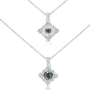 Macro detail of geometric silver necklace with grey moissanite stone and tiered zircons