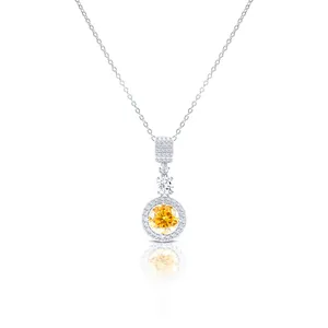 Macro view of sterling silver 18K plated necklace with a yellow moissanite pendant