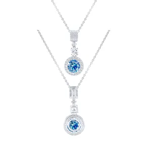Macro detail of silver necklace featuring a 5ct blue moissanite pendant and honeycomb back