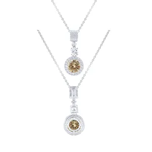 Macro view of sterling silver necklace with large round champagne moissanite pendant