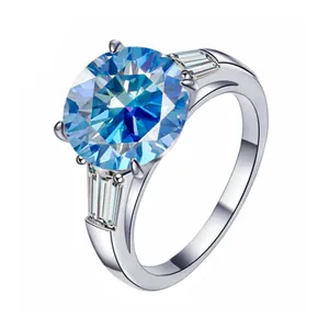 Macro shot of a 5-carat round blue moissanite silver ring with trapezoid side stones