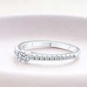 Classic S925 sterling silver moissanite ring with four-prong setting and side accents