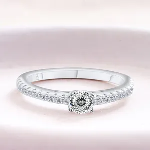 Classic S925 sterling silver ring featuring a round moissanite center stone and pavé accents
