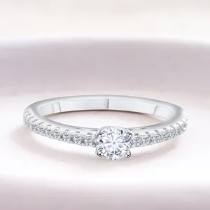 Classic S925 sterling silver moissanite ring with round four-prong setting on pink base