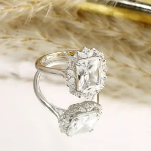 Radiant cut 4 carat moissanite halo ring in S925 sterling silver with a mirror reflection