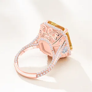 Detailed close-up of rose gold S925 ring with yellow radiant cut stone and side carvings