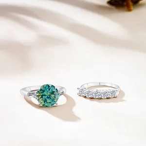 Macro detail of S925 sterling silver ring set with green moissanite and side stones