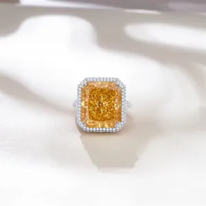 Detailed macro view of an emerald-cut yellow carbon diamond ring in 925 sterling silver