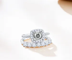 Detail of 925 sterling silver two-piece ring set with round halo moissanite stones