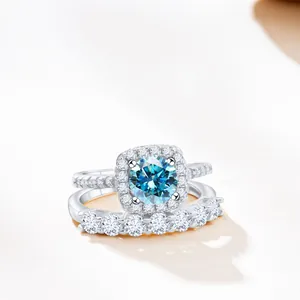 S925 sterling silver ring set with 1.7ct round blue moissanite and halo diamond accents