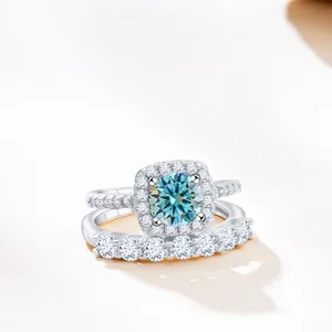 925 silver ring set with light blue round moissanite and matching pavé diamond band