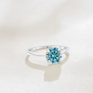 Macro shot of S925 sterling silver ring showing the hallmarked band and sparkling blue moissanite
