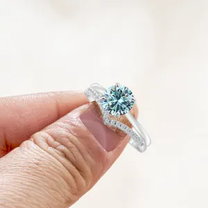 S925 sterling silver ring set with light blue moissanite and V-shaped diamond band