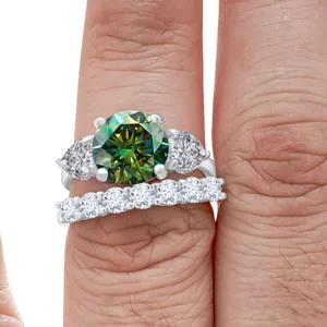 Luxurious 12ct green moissanite ring set in 925 silver shown on a finger