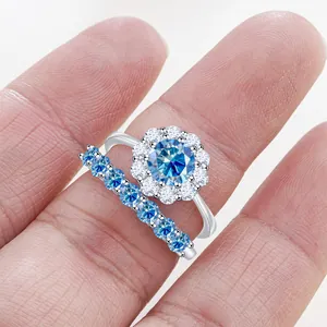 Macro shot of S925 silver moissanite ring set with sea blue gemstone and side stones