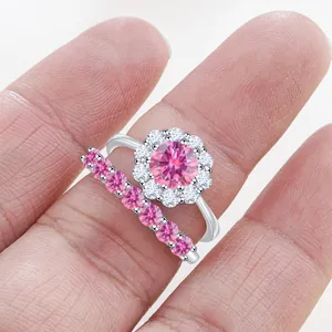 Close-up of S925 sterling silver halo ring set with sparkling pink moissanite stones