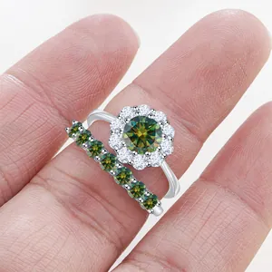 Elegant S925 silver flower moissanite ring set with green gemstone on woman finger