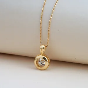 Macro shot of 2ct Moissanite pendant with S925 silver hallmark and gold finish
