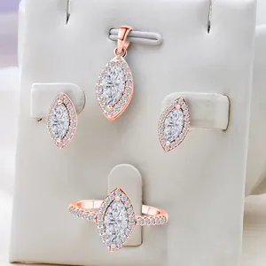Close-up of S925 silver mark on rose gold jewelry set with marquise cut stones