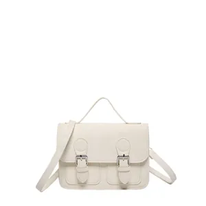 Vintage cream faux leather satchel bag with double buckle straps and adjustable shoulder strap