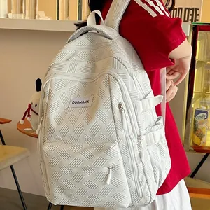White textured large capacity backpack for women showing modern casual school bag style