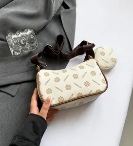 Detail view of cream vintage printed hobo bag with matching round coin purse set