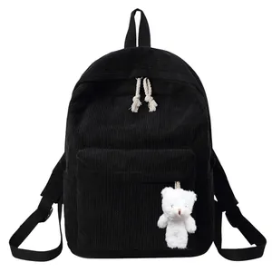 Minimalist black corduroy backpack for women with cute white plush bear keychain