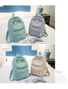 Detailed corduroy backpacks in mint green, grey and beige with large front zip pockets