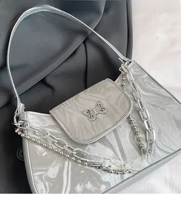 Silver marble pattern handbag with decorative metal butterfly buckle and chunky chains