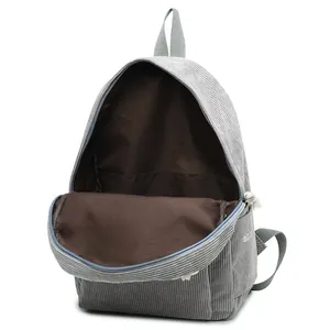 Grey corduroy backpack with spacious interior and white embroidered side detailing