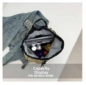Vue détaillée du sac seau en nylon kaki avec grande capacité de rangement interne