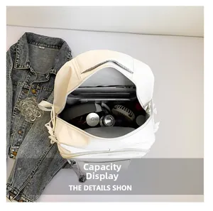 Internal view showing large capacity and functional compartments of the white backpack